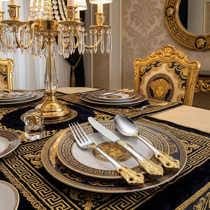 The Everly Quinn Luxury Gold Accent Flatware Set paired with gourmet dishes, revealing the luxurious dining experience it creates.
