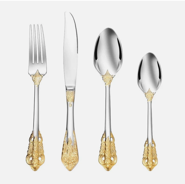Presentation of the Everly Quinn Luxury Gold Accent Flatware Set at a wedding table, enhancing the upscale atmosphere of the occasion.