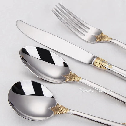 Everly Quinn Luxury Gold Accent Flatware Set with reflective finish displayed on a lavish dining table, illustrating its exquisite design.
