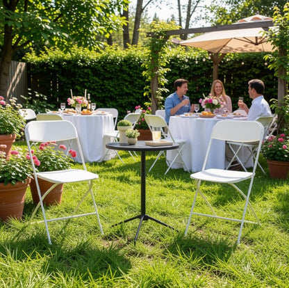 Beautifully set dining area using white folding chairs, perfect for creating a polished event space.