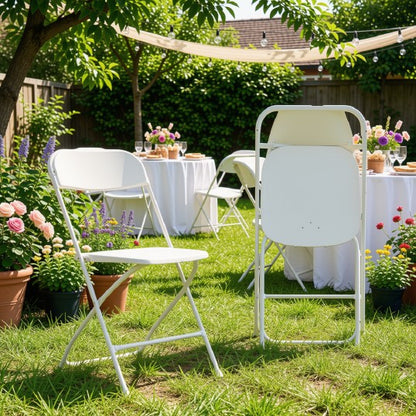 White folding chairs elegantly arranged at a reception, ideal for stylish seating at events.
